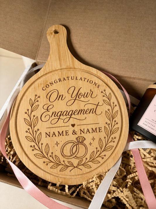 Close-up of personalised round engagement chopping board in gift box
