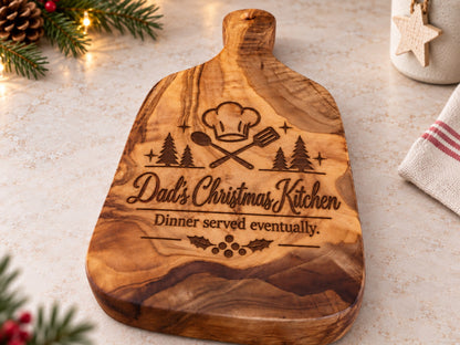 Personalised Christmas olive wood chopping board engraved with Dad's Christmas Kitchen design