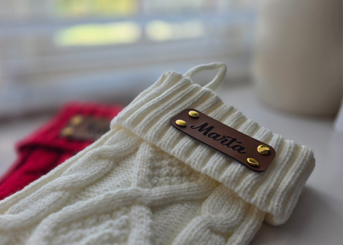Knitted Christmas stocking with engraved leather name tag and gold rivets