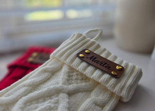 Knitted Christmas stocking with engraved leather name tag and gold rivets
