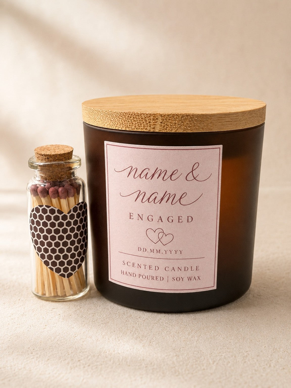 Personalised engagement candle with couple names and bottle of matches