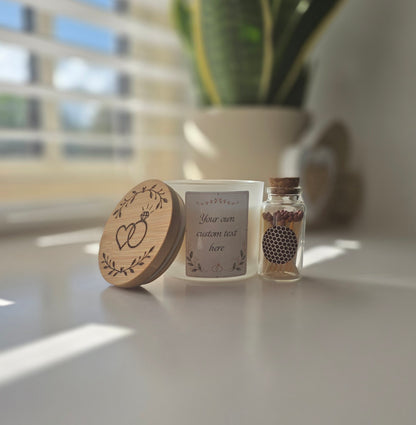 White personalised engagement candle with engraved wooden lid and bottle of matches