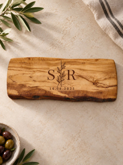 Personalised olive wood chopping board engraved with initials and date