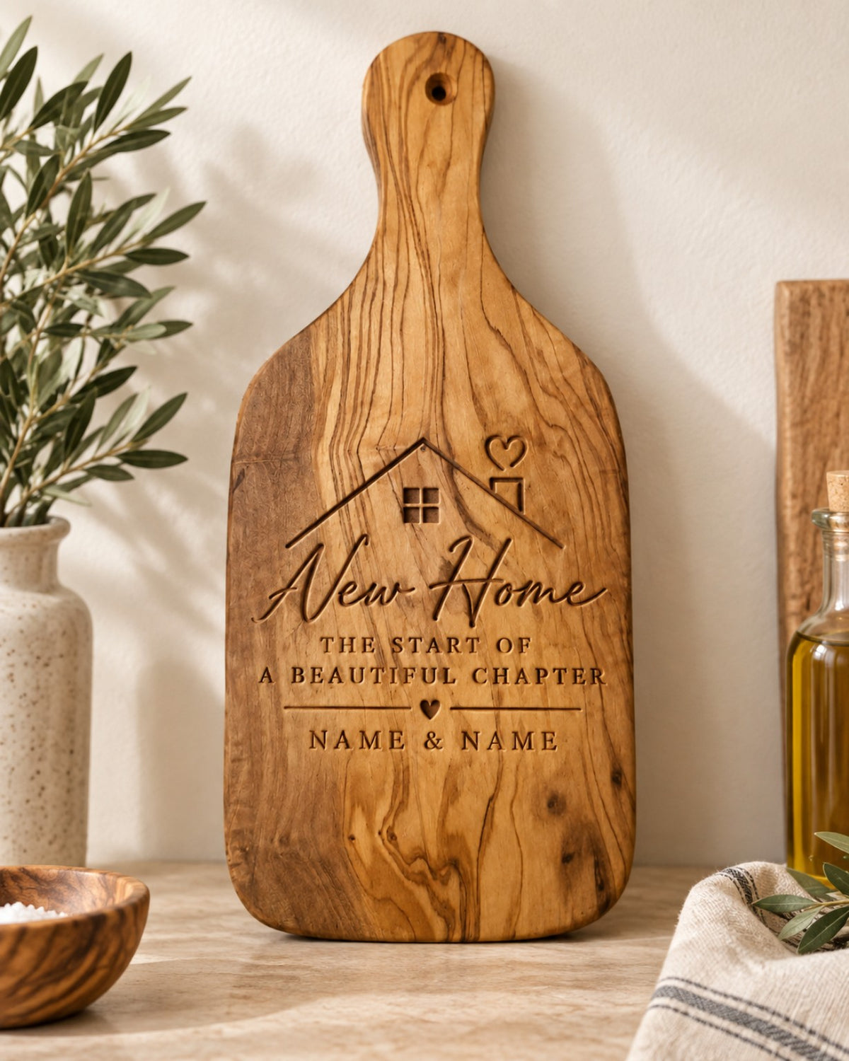 Personalised engraved olive wood chopping board for a new home gift